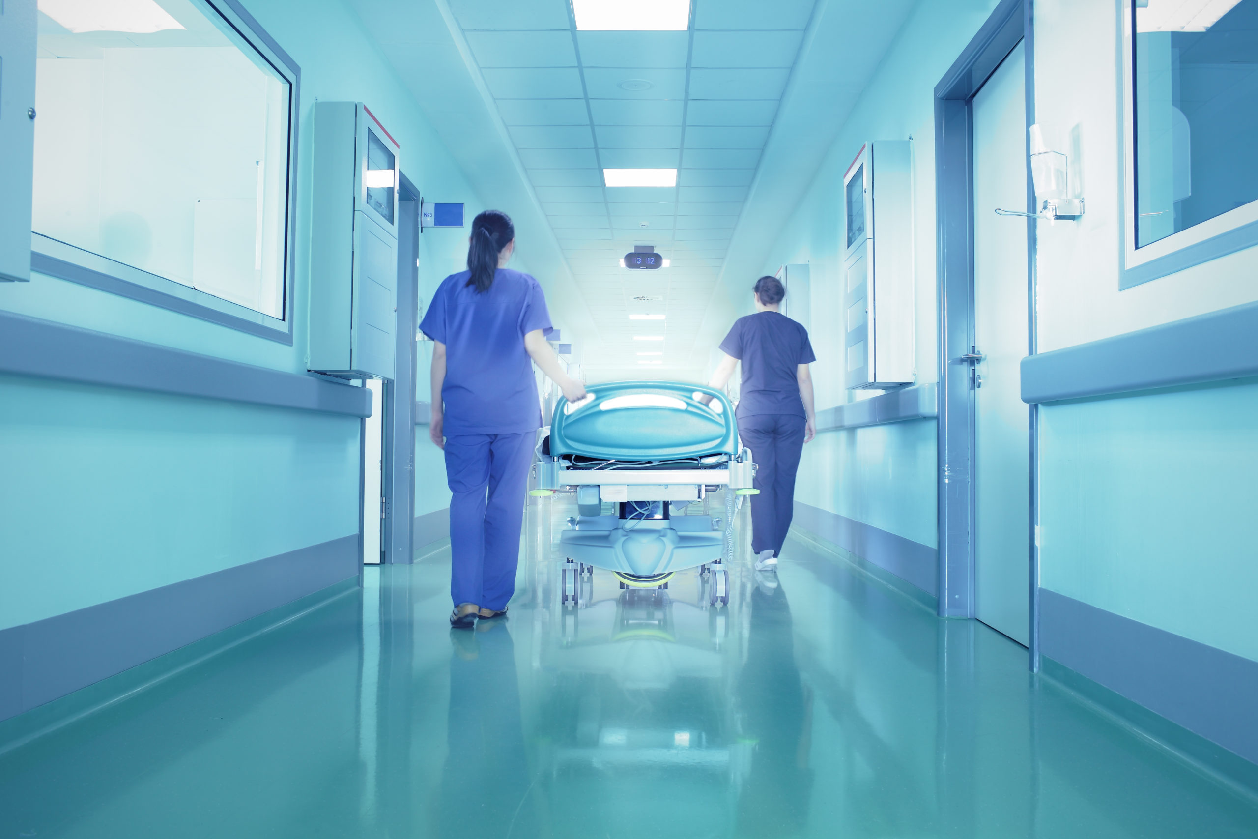 Hospital corridor with doctors dragging a gurney - food processor